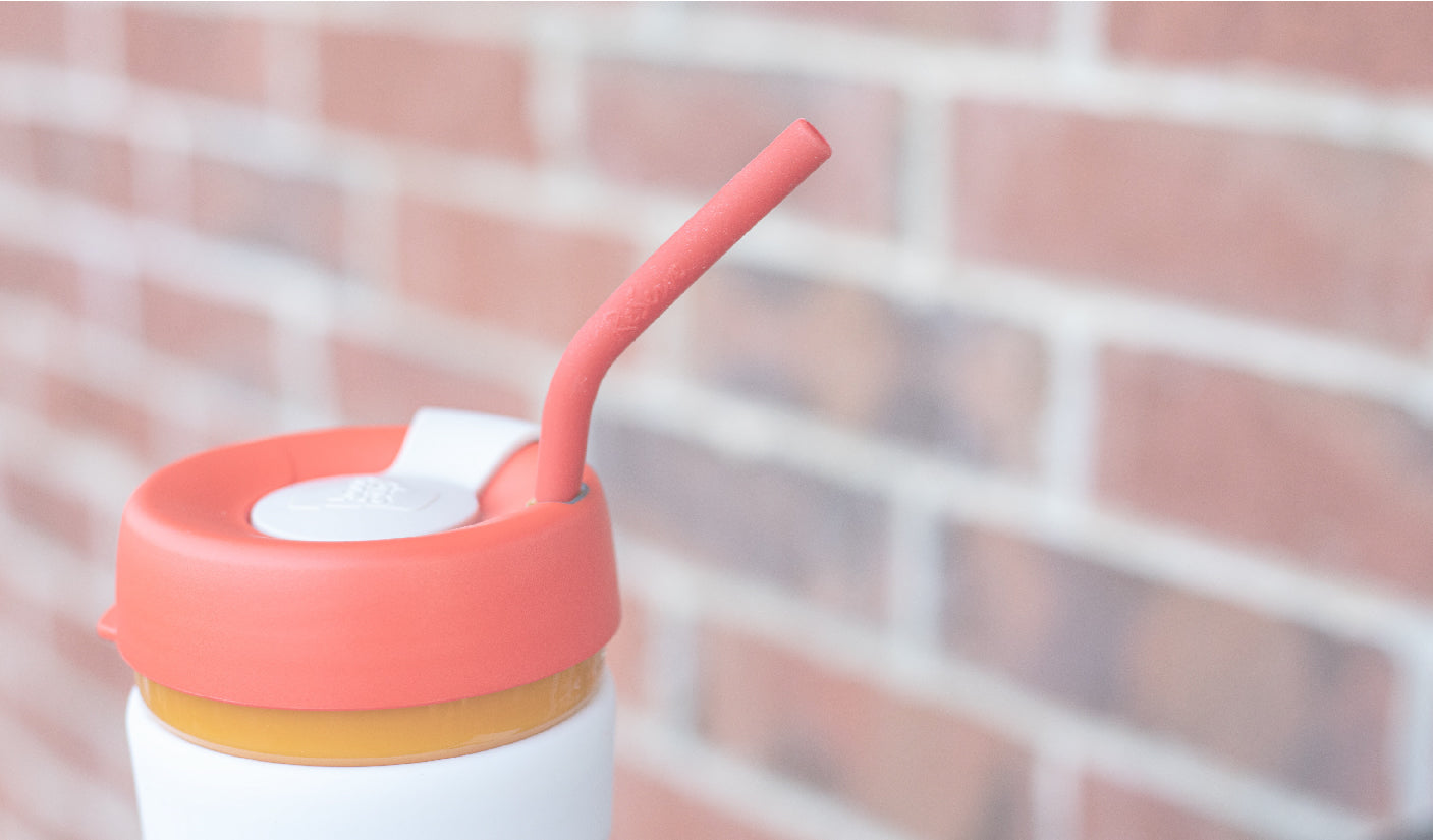 ReServe Ruby Red silicone reusable straw in a red-band ReServe x KeepCup reusable tumbler