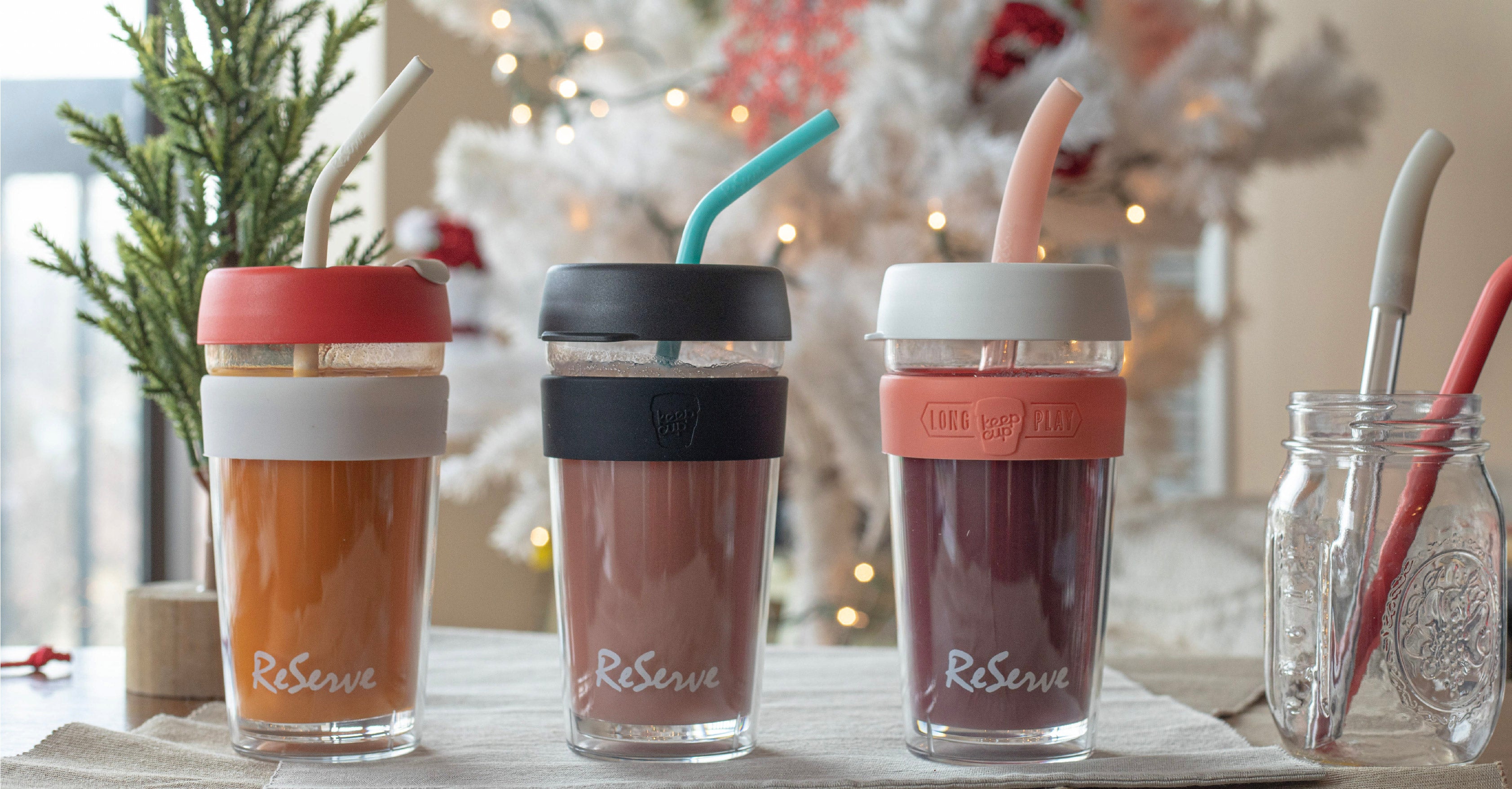 3 ReServ reusable straws in 3 KeepCup filled with fruity drinks